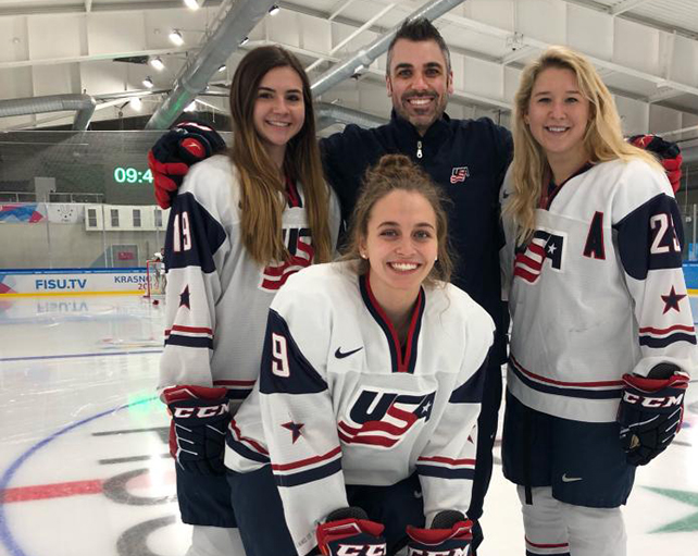 hicks a male, Scott Hicks, the first coach for Indiana Tech's women's hockey, is seen with three female players from the US National team